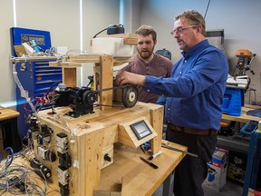 Gordon Maretzki works with a student on a prototype project at the Walker Advanced Manufacturing Innovation Centre at Niagara College.