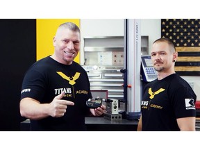 From Left: Titan Gilroy, CEO, Titans of CNC is pictured in his workshop holding a Mitutoyo QuantuMike Micrometer with Travis Jarrett, Quality Manager, Titans of CNC to announce Mitutoyo's new partnership with Titans of CNC.