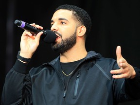Singer Drake greets the audience in Toronto, Ont. The recording artist is launching a cannabis company with Canopy Growth Corp.