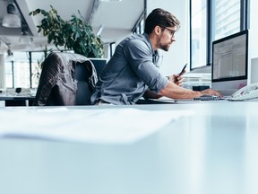 An entrepreneur working at his desk.