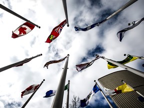 Canada's flag and the provincial flags fly in Toronto.