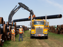 Crews load pipe for Enbridge’s Line 3 pipeline replacement project, near Hardisty, Alberta.