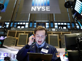 A trader works on the floor of the New York Stock Exchange.