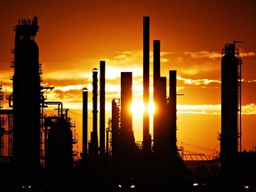 An oil refinery in Edmonton. Moody’s downgraded Alberta’s credit rating, citing weakness in the provincial economy that remains concentrated and dependent on non-renewable resources — mainly oil.