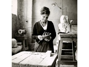 Louise Bourgeois in her studio in Italy contemplating GERMINAL, 1967. © The Easton Foundation