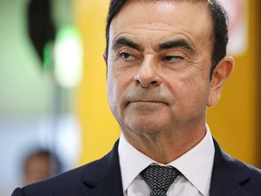 In this file photo taken on November 8, 2018, then Chairman and CEO of Renault-Nissan-Mitsubishi Carlos Ghosn looks on during a visit of French President at the Renault factory, in Maubeuge, northern France. Ghosn, who was on bail in Tokyo awaiting trial on financial misconduct charges, has fled to Lebanon.