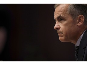 Mark Carney the Governor of the Bank of England listens to a journalist's question during a Financial Stability Report press conference at the Bank of England in the City of London, Thursday, July 11, 2019.