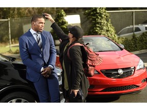 This Jan. 13, 2017 photo shows NFL player Cam Newton getting primped during the filming of a car commercial for Super Bowl telecast in Los Angeles. The Supreme Court of Canada is expected to set down legal principles today that help settle disparate feuds over Super Bowl TV commercials and whether the sons of Russian spies are actually Canadian.