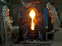 Workers at Detour Gold pour metal. 