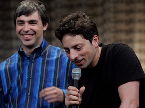 Google founders Larry Page, left, and Sergey Brin talk with members of the media at Google Press Day 2006.
