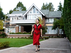 Meng Wanzhou, chief financial officer of Huawei Technologies Co., leaves her home for a court appearance wearing an electronic ankle tag in Vancouver, British Columbia, on Tuesday, Oct. 1, 2019.