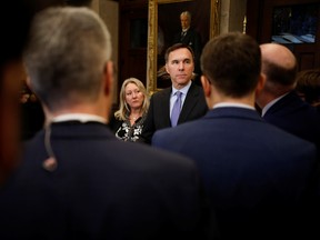 Minister of Finance Bill Morneau and Minister of Middle Class Prosperity Mona Fortier in the House of Commons foyer on Parliament Hill in Ottawa on December 9, 2019.