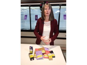 Nova Scotia Liquor Corp. spokeswoman Bev Ware shows off a selection of infused teas and vaping products at the Nova Scotia Liquor Corp. Cannabis in Halifax on Tuesday, Dec. 24, 2019. Stocking stuffers with a kick are moving briskly off the shelves at Nova Scotia's government operated cannabis shops in the leadup to Christmas. In a viewing of Nova Scotia Liquor Corp.'s early offerings of various "edibles" products, spokeswoman Bev Ware notes quite a few cupboards were already bare.