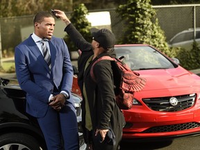 NFL player Cam Newton get ready for the filming of a car commercial for Super Bowl telecast in Los Angeles.