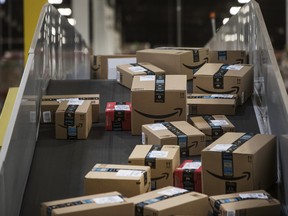 Packages move on a conveyor belt at an Amazon.com Inc. fulfillment centre.