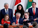 Canada's Deputy Prime Minister Chrystia Freeland, Mexican Deputy Foreign Minister for North America Jesus Seade, and U.S. Trade Representative Robert Lighthizer sign a trade deal at the Presidential Palace in Mexico City, Mexico Dec. 10, 2019.