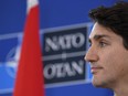 Prime Minister Justin Trudeau gives a press conference in the media centre at the NATO summit held in the Grove hotel in on December 4, 2019 in Hertford, England.