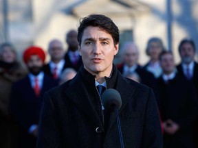 Justin Trudeau, Canada's prime minister, and his MPs at a swearing in ceremony for the new liberal minority government at Rideau Hall in Ottawa, last month.