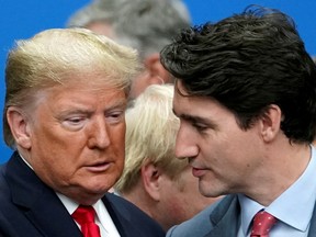 U.S. President Donald Trump talks with Canada's Prime Minister Justin Trudeau during a North Atlantic Treaty Organization Plenary Session at the NATO summit in Watford, Britain, December 4, 2019.