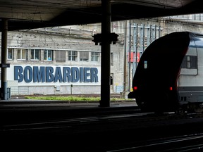 A Bombardier advertising board is pictured in front of a SBB CFF Swiss railway train at the station in Bern, Switzerland, October 24, 2019.