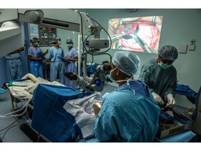 Doctors at the Tej Kohli Cornea Institute perform a conventional corneal transplant surgery