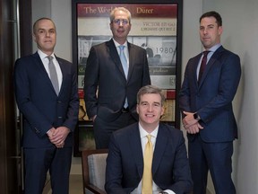 Canaccord Genuity Corporation's (left to right)  Steve Winokur, managing director, head of healthcare, investment banking, Michael Shuh, managing director, head of financial institutions investment banking, Jamie Nagy, (seated) managing director, co-head Canadian mergers & acquisitions and Len Sauer, managing director-equity capital markets at their Toronto offices.