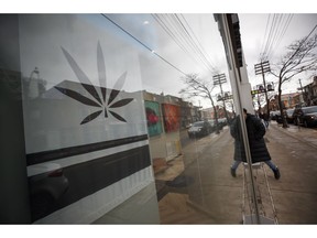 A customer walks into a Cannabis dispensary on Queen St. in Toronto, Monday, Jan. 6, 2020.