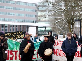Supporters of the Wet’suwet’en Nation who oppose the construction of the Coastal GasLink pipeline, protest outside the provincial headquarters of the Royal Canadian Mounted Police (RCMP) in Surrey, British Columbia, January 16, 2020.