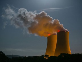 Cooling towers emit vapor into the night sky at Grohnde nuclear power plant, operated by E.ON SE, in Grohnde, Germany, on Thursday, July 30, 2015.