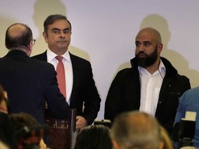 Former Nissan chief Carlos Ghosn, centre, arrives at the Lebanese Press Syndiate for his highly anticipated press conference in the capital Beirut on January 8, 2020.