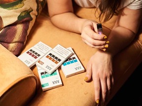 A Juul Labs Inc. e-cigarette and flavored pods are arranged for a photograph in New York. Earlier this month, the Trump administration announced a ban on some popular e-cigarette flavors, including fruit and mint, allowing only menthol and tobacco flavors to remain on the market.