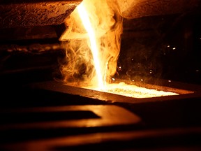 Liquid gold is poured to create bars at a Newmont mine in Nevada.