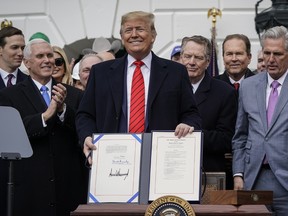 U.S. President Donald Trump stands after signing the United States-Mexico-Canada Trade Agreement (USMCA) during a ceremony on the South Lawn of the White House on January 29, 2020 in Washington, D.C.