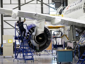 An employee works on an Airbus A220-300 at the Airbus facility in Mirabel, Quebec, February 20, 2020.