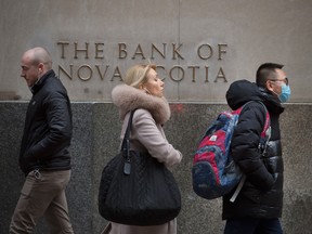 Pedestrians walk past the Bank of Nova Scotia moniker on Toronto's Bay Street in January.