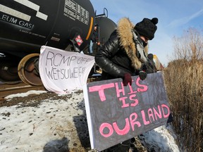 Supporters of the Wet'suwet'en Nation take a break during occupation of railway tracks, as part of a protest against British Columbia's Coastal GasLink pipeline, in Toronto, on Feb. 15.
