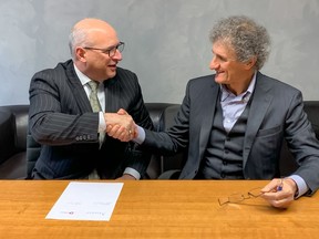 Ascend Performance Materials CEO Phil McDivitt and D'Ottavio Group president Giancarlo D'Ottavio signing an agreement for the purchase of Poliblend and Esseti Plast GD.