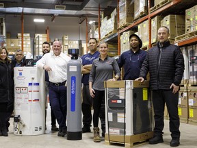 Reliance Home Comfort employees at the company’s warehouse in Richmond Hill, Ont. From left, Batia Haber, sales manager; Rishie Kamal, install manager; Anthony DeGasperis, install manager;  Sean O’Brien, president & CEO; Christian Carrington, warehouse runner; Sherri Woodman, general manager GTA; Dwain Cooke, warehouse manager; and Aaron Cassidy, service manager.