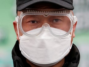 A security guard outside a factory in Beijing.