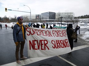 Supporters of the Wet’suwet’en nation indigenous group who oppose the construction of the Coastal GasLink pipeline, protest outside the provincial headquarters of the Royal Canadian Mounted Police (RCMP) in Surrey, British Columbia, January 16, 2020.