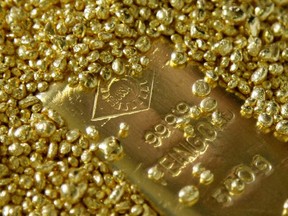 Bullion held firm even as European shares hit a fresh record high on a decline in new cases of coronavirus in China, and as the dollar rose to a more than four-month high against rivals.
