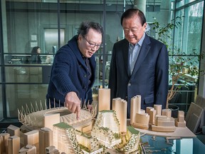 Singapore tycoon, Oei Hong Leong with Vancouver architect, James Cheng examine a model of the proposed Expo Gardens development in False Creek.
