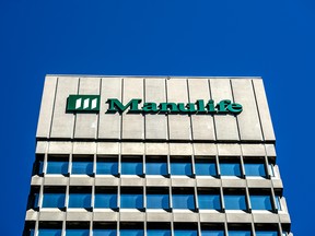 Manulife posted record annual earnings, increased its dividend 12 per cent and surpassed one of its long-term goals three years ahead of schedule.