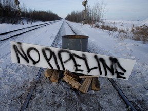 Protesters block the CN rail line near 213 Street and 110 Avenue in solidarity with Wet'suwet'en Hereditary Chiefs, in Edmonton Wednesday Feb. 19, 2020.