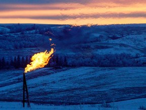 A natural gas flare on an oil well pad burns as the sun sets outside Watford City, North Dakota. Oil prices could plunge on fears of how the coronavirus will impact the Chinese economy.
