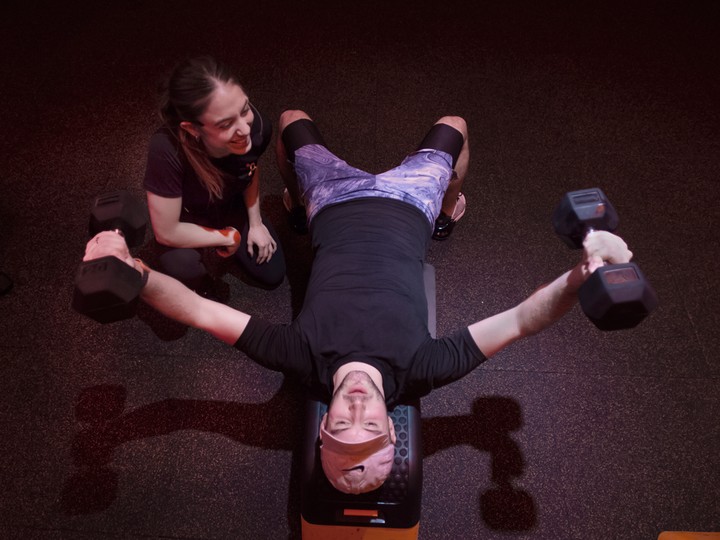  Orangetheory fitness coach Nicole Adjeleian takes participant Jake Rehorst through a workout in Toronto.