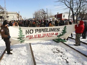 Indigenous groups and their supporters block the CP rail line in Toronto in support of the Wet'suwet'en protest against the Coastal GasLink pipeline project in British Columbia.