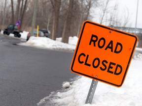 A sign indicates a closed road due to a blockade in Kahnawake Mohawk Territory, south of Montreal.