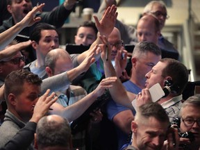 Traders fill orders in the S&P options pit near the close of trading on the Cboe Global Markets trading floor on Jan. 31, 2020 in Chicago, the day U.S. officials declared the coronavirus outbreak a public health emergency.