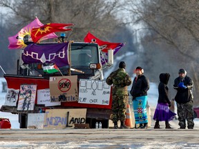 Protestors are seen at the site of a rail stoppage on Tyendinaga Mohawk Territory, as part of a protest against British Columbia's Coastal GasLink pipeline, in Tyendinaga, Ontario, Canada, February 16, 2020.